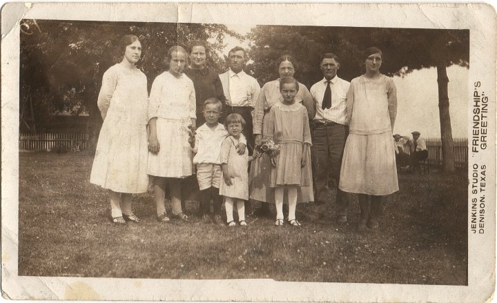 0006.jpg - Bertha Gingerich, John & Ruth Schrock, George, Alta, Verda, Geneva Gingerich, Freeman, Bernice & Kathryn Schrock.  1915c  Jenkins Studio, Dennison, TX