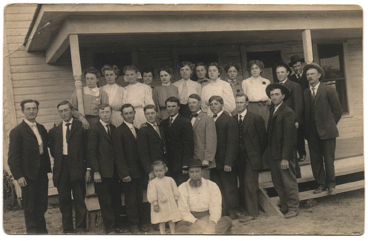 0011.jpg - Texas Young People, Abe Swartzendruber front center; Katie Swartzendruber, 5th from left.  Ruth & Alta Swartzendruber back row, last 2 women from the right.  John Schrock front center, shortest.