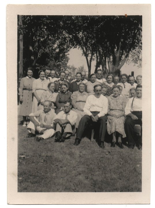 0012.jpg - Joseph C. Swartzendruber Reunion.  1920.  Katie Swartzendruber Reschly 2nd row from front, second from left, dark dress.