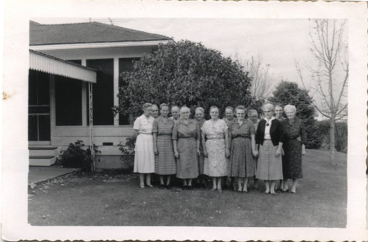 0045.jpg - Katie Swartzendruber and Swartzendruber Cousins  1958c  Unknown names.  Katie is back row, 3rd from left.  Mother of Marjorie Yoder, back.  Edwin S. sister, black sweater, front.