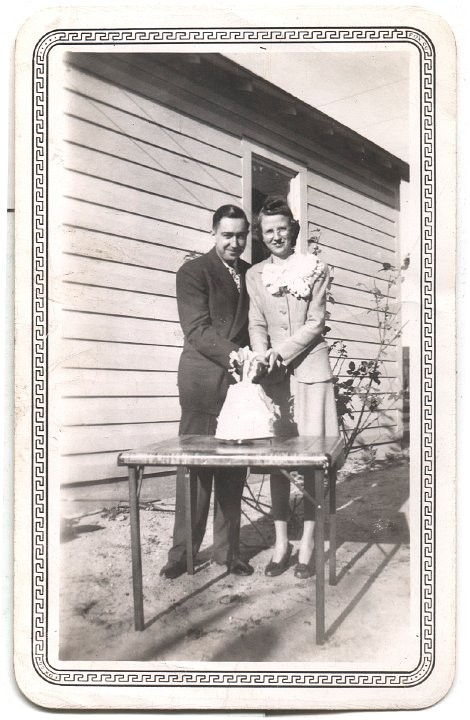 0265.jpg - Freeman & Bertha Gingerich cutting wedding cake.  1948c