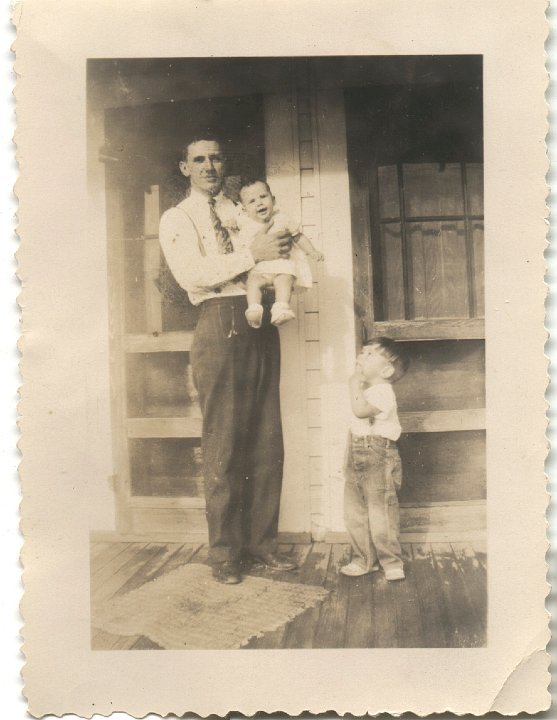 0283.jpg - unknown:  man holding boy.  1935c   see also #0251 & #0261