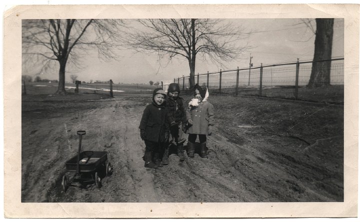 0320.jpg - Fred Roth, Robert & Alice Kauffman with a wagon.  1953c