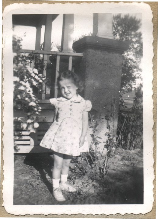 0376.jpg - Louise Reschly standing in yard.  1946c  booklet 5 of 10