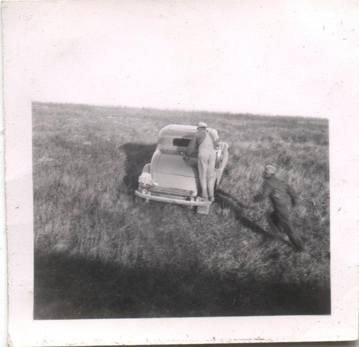 0551.jpg - Driving in the field.  Ray Roth & unknown.  1943c