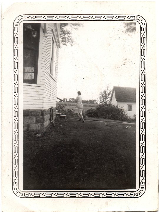 0748.jpg - unknown woman running around the house.  1943c