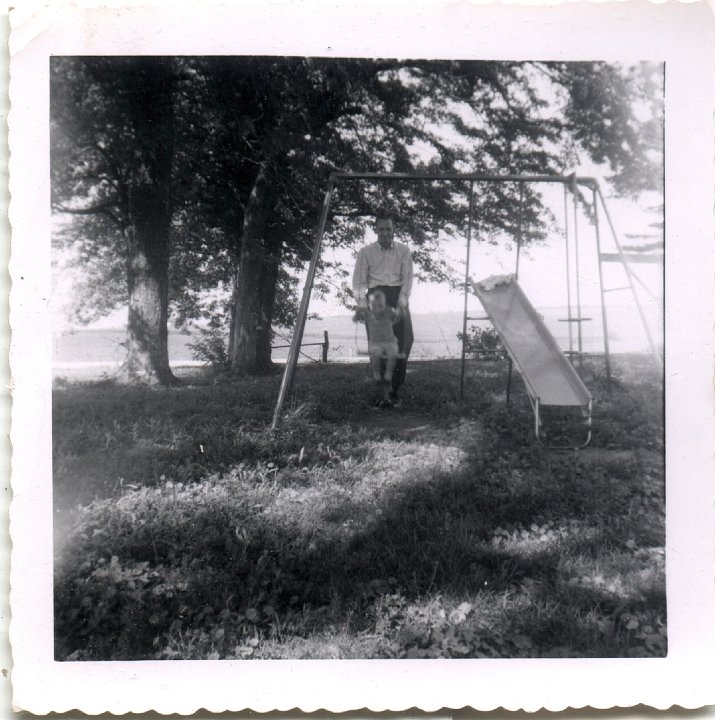 0754.jpg - unknown boy pushed by unknown man on swing.  1953c