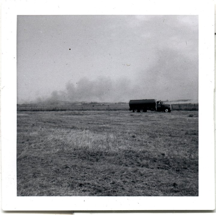 0768.jpg - firetrucks in a field.  1957c