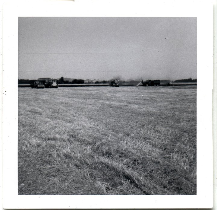 0769.jpg - firetrucks in a field.  1957c