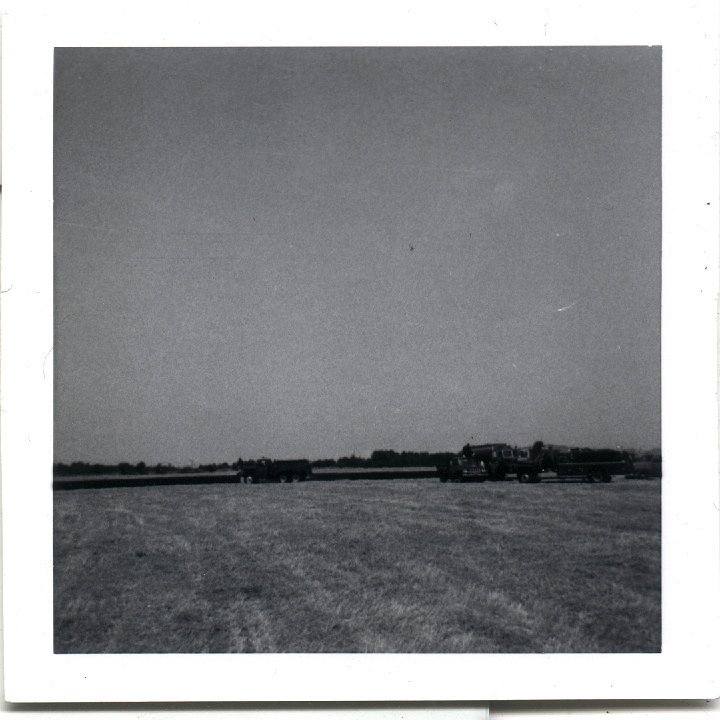 0770.jpg - firetrucks in a field.  1957c