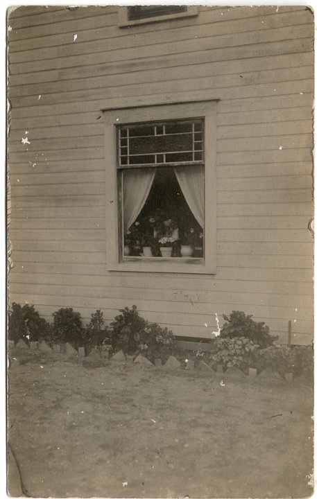 0775.jpg - Window with stained glass.  Peter Unzicker's house where Katie & William Swartzendruber were married in front of this window.  1915c