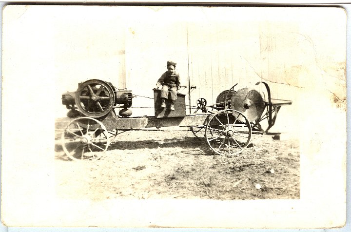 0879.jpg - Buzz saw and child, 1912c