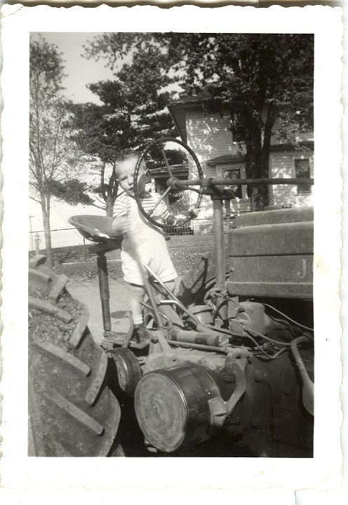 0926.jpg - Fred Roth on the John Deere tractor.  1948c