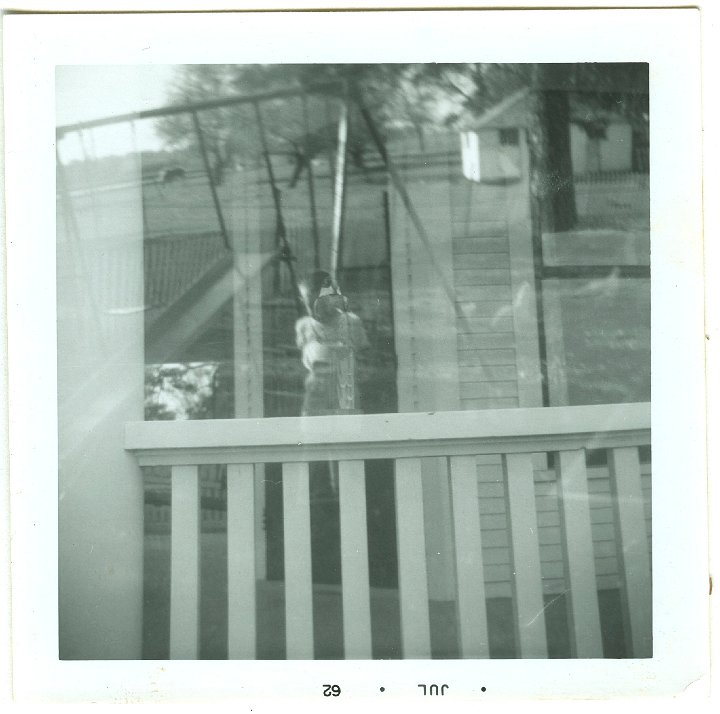 0961.jpg - Lamar Swinging.  Porch.  double exposure.  1962