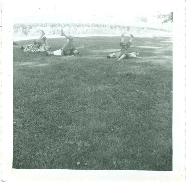 1044.jpg - Leg wrestling in the yard.  1958