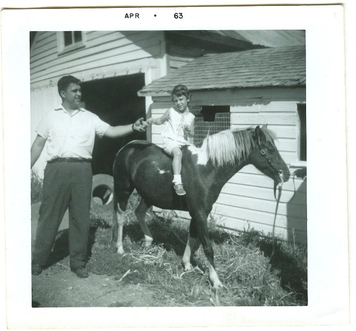 1056.jpg - Wayne King with daughter on horse.  1963