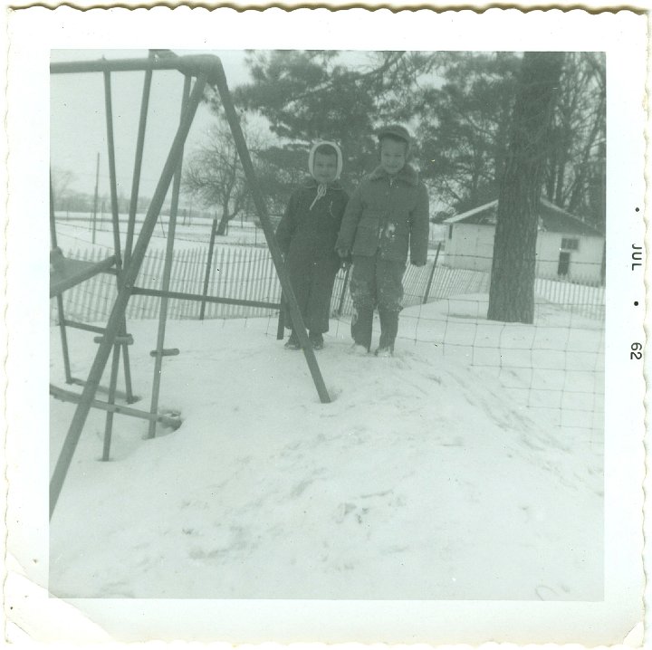 1164.jpg - Lamar Roth and unknown friend on snowbank.  1962