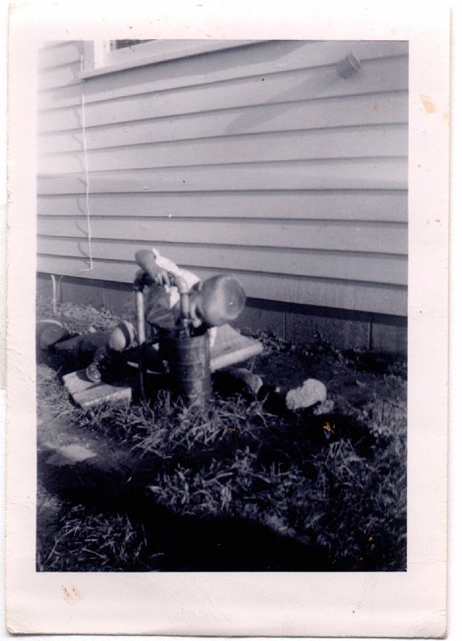 1510.jpg - Larry Roth drinking from the faucet.  1952c