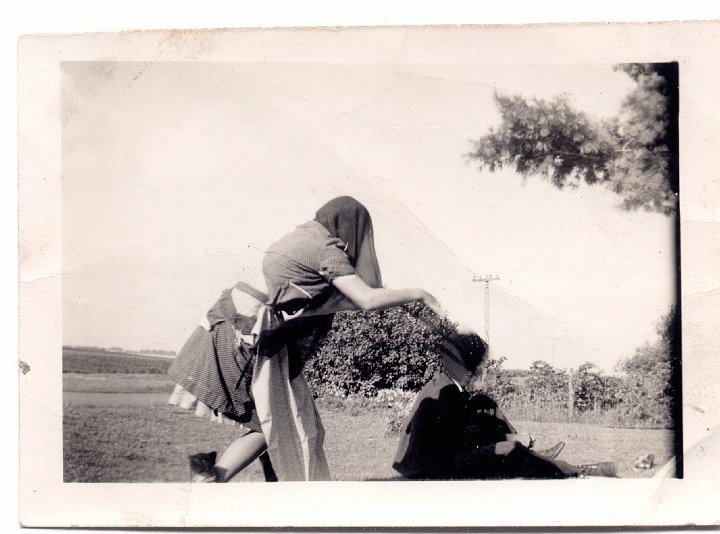 1569.jpg - unknown person  running from the camera.  1954c