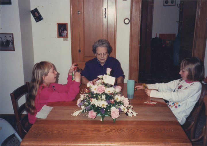 1957.jpg - Meryl, Edna & Alex Roth playing cards