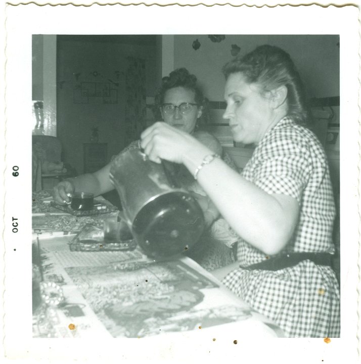 1360.jpg - Dorothy R. Boese & Edna Beckler, neighbors having coffee on a special occasion with the glass party sets.  1960