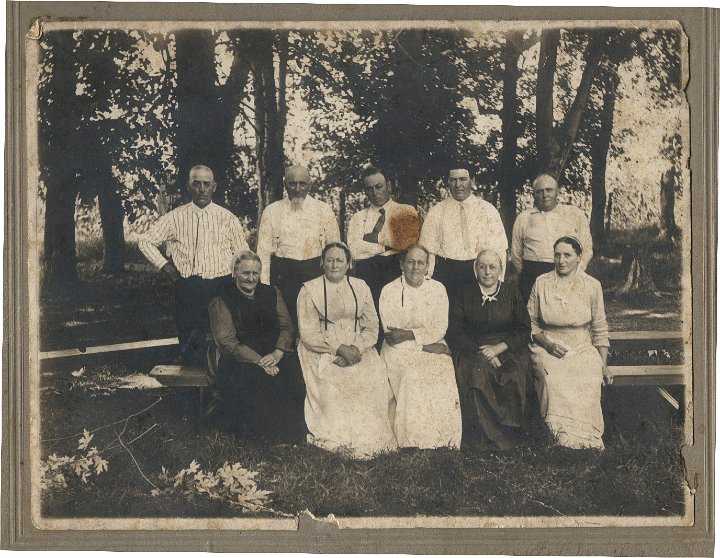 0021.jpg - Swartzendruber Aunts & Uncles  1920  First Joseph C. Swartzendruber Reunion.  front left:  Katrina [Katie] s. Yoder, Mary S. Boller, Rebecca S. Yoder, Lovina S. Miller, Lydia S. Eicher [still had a covering but soon belonged to Eicher Church where there were no coverings].  Back:  Joseph Swartzendruber [Honey Joe--Had a girlfriend who called him 'Honey' all the time, Christian [Crissy Cracker], Wiliam Harvey, John [Bally John:  Wore a wig & was bald, bally], Elias [Eli][Eli Hopper--was crippled.  Peddled frozen fish.]