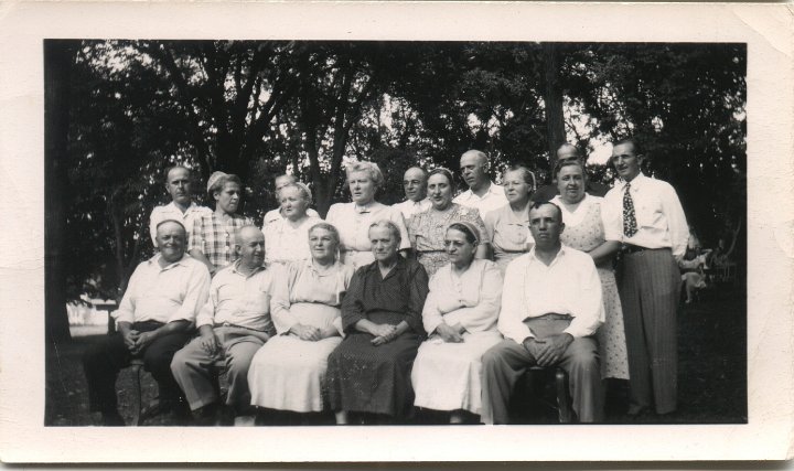 0303.jpg - Swartzendruber Cousins  1940cfront:  Eli Swartzendruber, Jason Yoder, Mamie Rensberger, Barbara Marvin, Katie Reschly, Joe Erb; back:  John Rhodes, Grace Rhodes, Ethel Bender, ??? behind Ethel, Vina Gingerich, ???, Ollie Blosser, Emerson Swartzendruber, Becky Yoder, Bertha Yoder, ??? behind Bertha, ???.