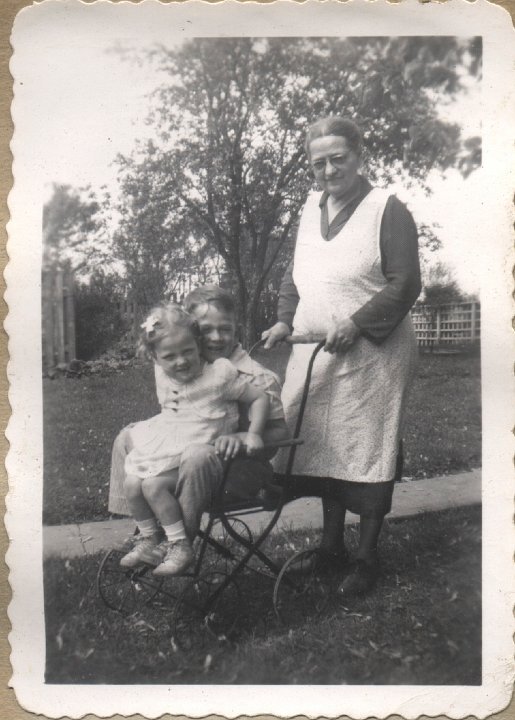 0379.jpg - Katie Reschly pushing Gary and Louise Reschly in buggy.  1946c  booklet 8 of 10.