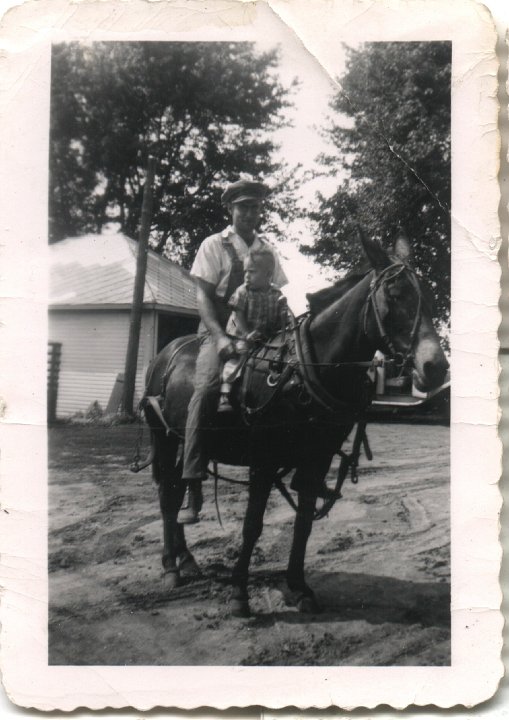 0224.jpg - Ray Roth & ??? on a work mule on the home place.