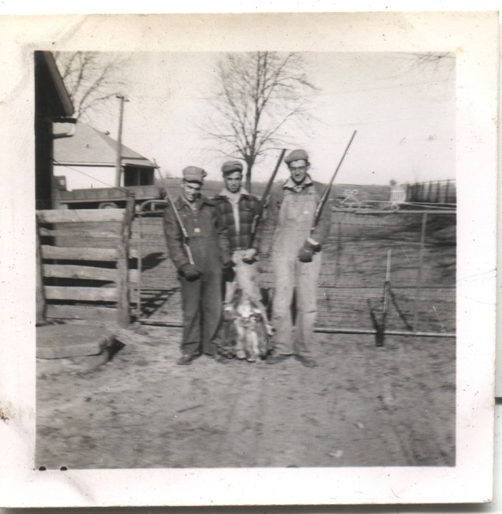 0548.jpg - Ray Roth and 2 unknown men going hunting.  1944