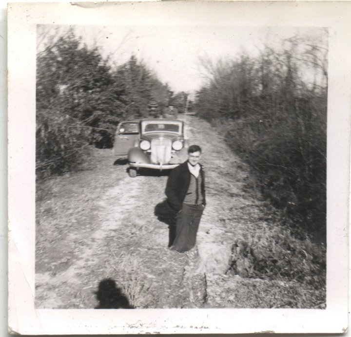 0553.jpg - Standing in a hole in the road.  Ray Roth  1941c