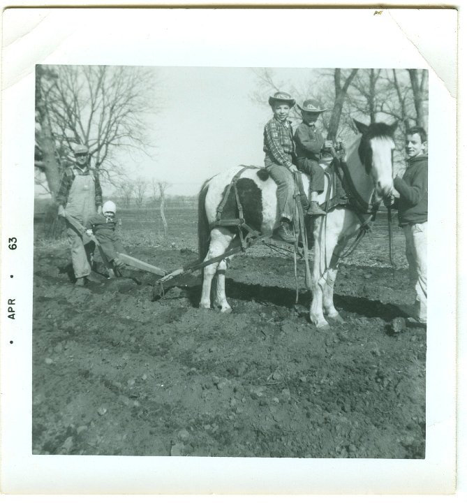 1151.jpg - Ray Roth, unknown, Reynolds, Lamar & Larry Roth planting potatoes. 1963   see #1143