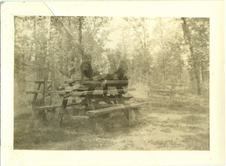 1254.jpg - Double exposure of Ray on the picnic table.  1942