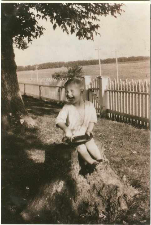 1303.jpg - Ray Roth running off with the frosting pan.  Helen was making the frosting.  1924c  Scan of a copy of the original whose owner is unknown.