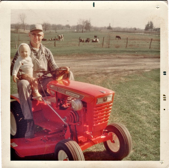 1887.jpg - Ray & Kevin on the garden tractor.  1969