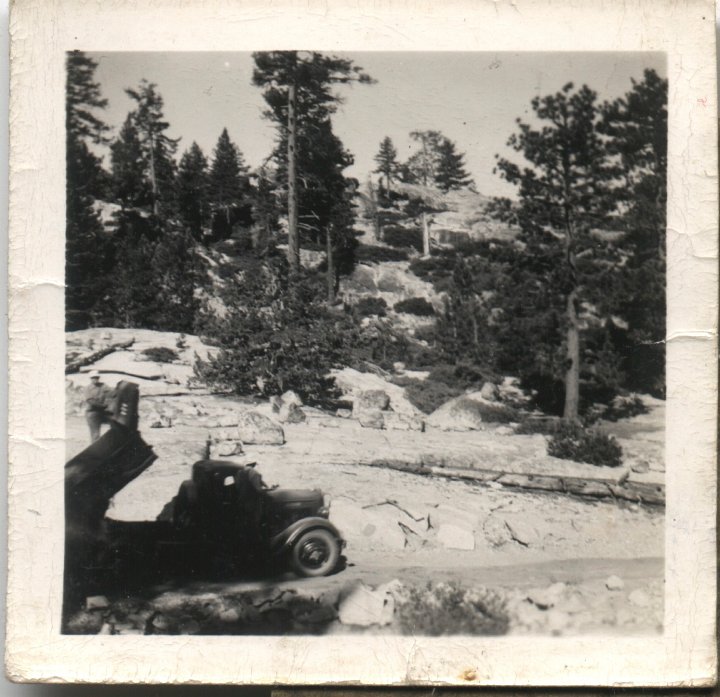 0120A.jpg - 'this is the way this country looks up here in the mointains about 3/4 rocks.  This is the dump truck we're using.' Harol Reschly, CPS1945c