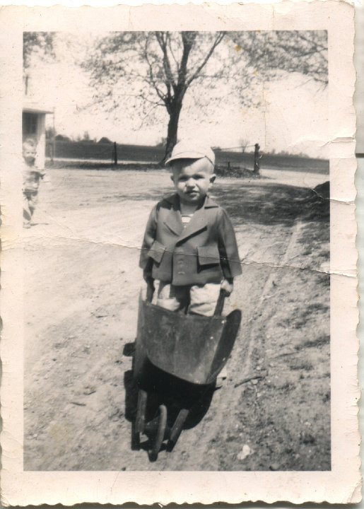 0305.jpg - Meredith Reschly with wheel barrow.  1953