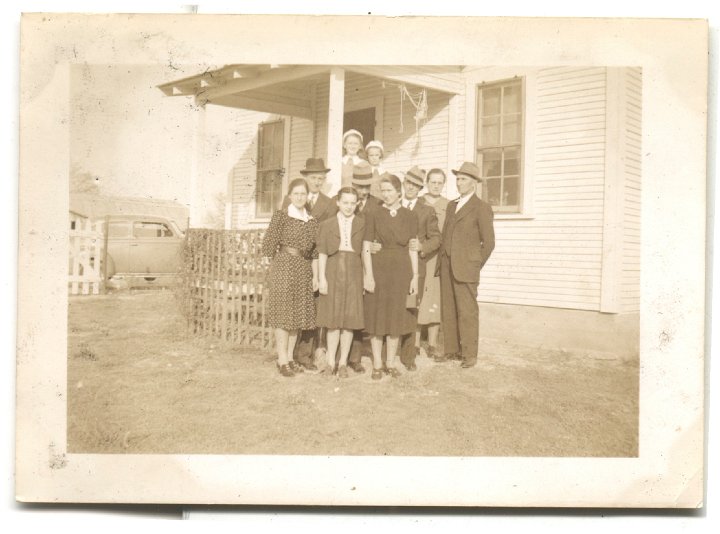 0451.jpg - Christmas Day 1940 at Oliver's.  Treva, LolaVon, Harold Bontrager, Freeman Gingerich, Oliver Hamilton, Alta & George Gingerich.  Front:  Geneva Bontrager, Edna Reschly, Verda Hamilton.  Trip to Texas  1940-41.