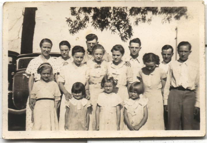 0632.jpg - Group photo:  Back row: Verda Gingerich, Ruth, Floyd, Ralph, Harold Reschly, Freeman Gingerich; 2nd row:  Isabelle Schrock, Edna Reschly, Bernice Schrock, Irene Reschly, Kathryn Schrock, Freeman.  Front:  Lola Von & Treva Bontrager, Geneva Ann Schrock  1935c