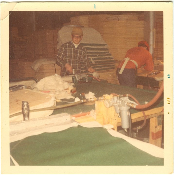 1229.jpg - Denny Reschly at work making seat covers at Blue Bird.  1969