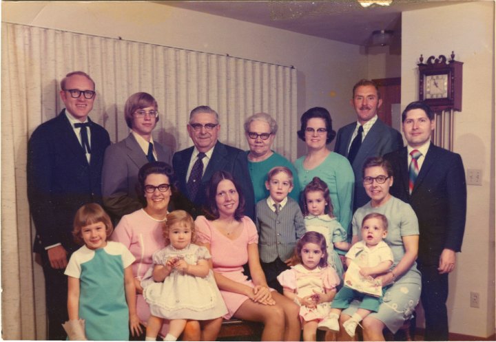 1347B.jpg - John & Alice Reschly Family  April 28,1973.  Back left:  Don Diller, Ken Stauffer, John & Alice Reschly, Linda R. & Delbert Schrock, Alan Mast.  Front left:  Donna, Jane R holding Joann Diller, Lois R. Stauffer, Phillip & Algela Schrock, Anita front pink, Jeannene R. holding Timothy Mast.