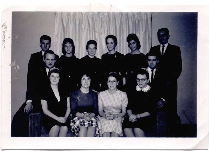 1672.jpg - Joanne Reschly MVS Unit in La Junta, CO.  1956c  Front:  Lara Mae Good, Elaine Rohrer, Martha Meyers, Maomi Miller.  Middle:  Jim Good, Cliff Neuenschwander. Back:  Ivan Weaver, Joanne Reschly, Clarabelle Roggie, Earlene Delp, Ellen Witte, David Bontrager.