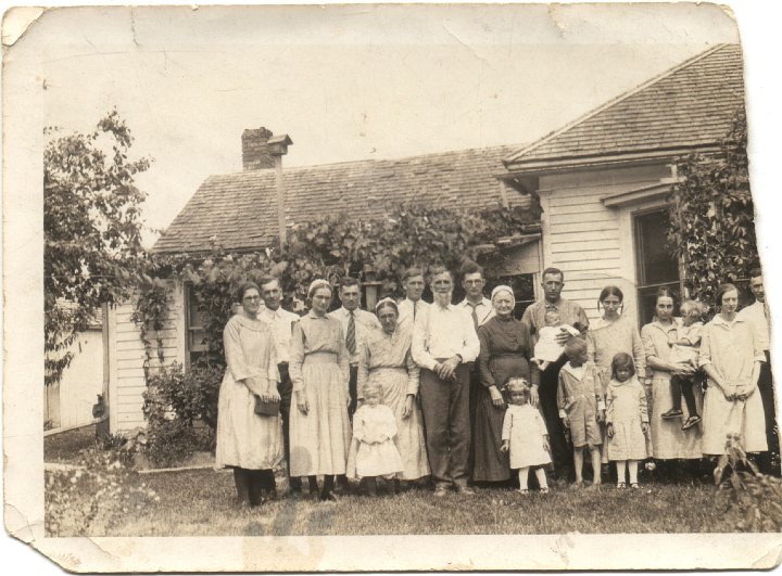 0010.jpg - Shem Swartzendruber Family.  Lived north of Noble, IA.  1910c  Earl & Mary Roth Swartzendruber left end.