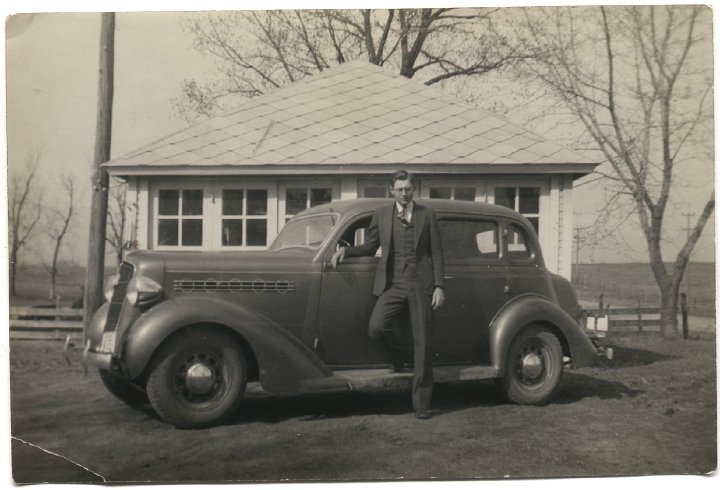 0188.jpg - Ray J Roth with his car in front of the garage at the house on Hwy 78