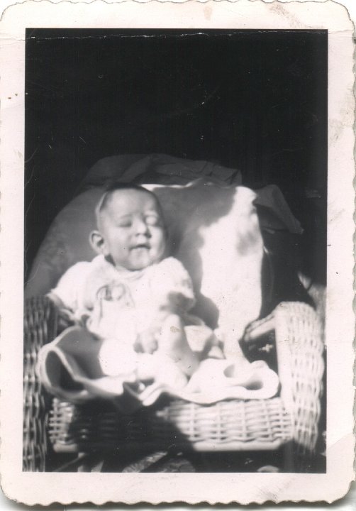 0404.jpg - Fred Roth in wicker chair.  1946c