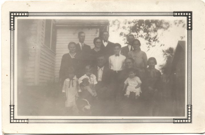 0422.jpg - Joseph Roth Family  1936c  back left/rt:  Earl Swartzendruber, Orie, Levi; middle:  Helen, Mary, Ray, Mayme; front:  Marie, Joseph holding Max, Fannie holding Miriam, Elsie  [I think]  Taken at Roth Homeplace on Hwy 78