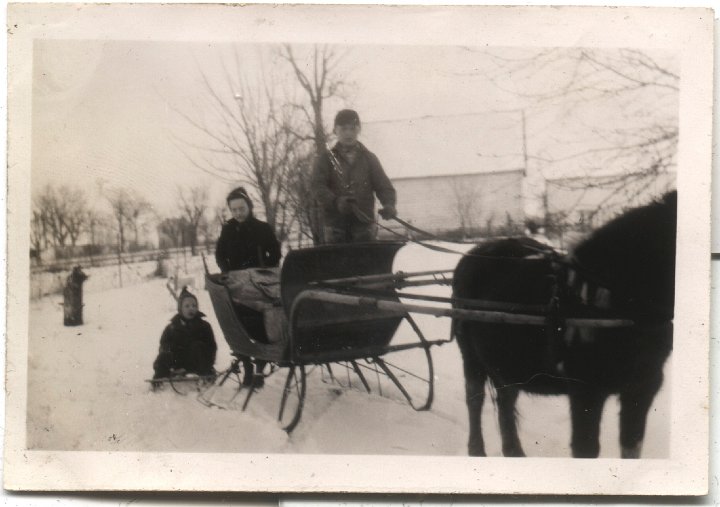 0625.jpg - Sleigh ride.  Edna Roth & unknown with a sleigh  1945c