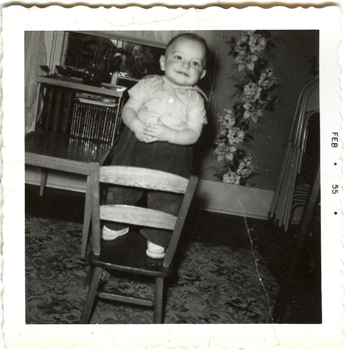 0933.jpg - Reynolds Roth standing on chair.  Feb 1955