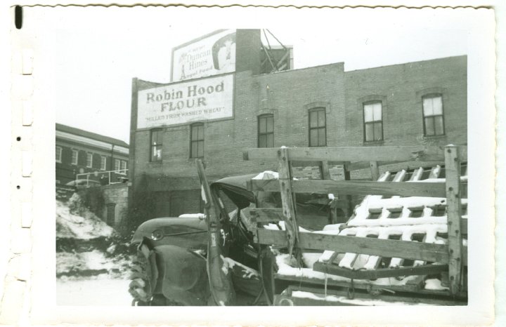 1233.jpg - Wrecked 54 Chevy 1 ton dualie truck driven by Levi Roth with Ray Roth as passenger.  They were taking a load of Easter lambs to market in Waterloo, IA.  A semi jack-knifed on ice, and the trailer slammed into them.  Levi was pinned inside and Ray was thrown from the truck.  Gas leaked from the tank and a fire started under the truck where Levi was.  George Widmer came by in a semi and put out the fire with his fire extingisher.  This occurred 1/2 mi north of Coralville Lake on old 218.  The truck was in a wrecking yard in Iowa City, IA.  1956