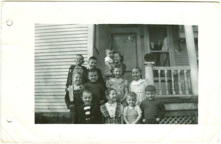 1353.jpg - Reschly cousins.  1952c  back left:  Fred Roth, Kenny Reschly, Louise Reschly holding Lynn Roth; middle:  Meredith Reschly, Dudley Pankoke, Joanne Reschly, Alice Kauffman; front:  Larry Roth, Ruth Ann Reschly, Wayne Pankoke, Denny Reschly.